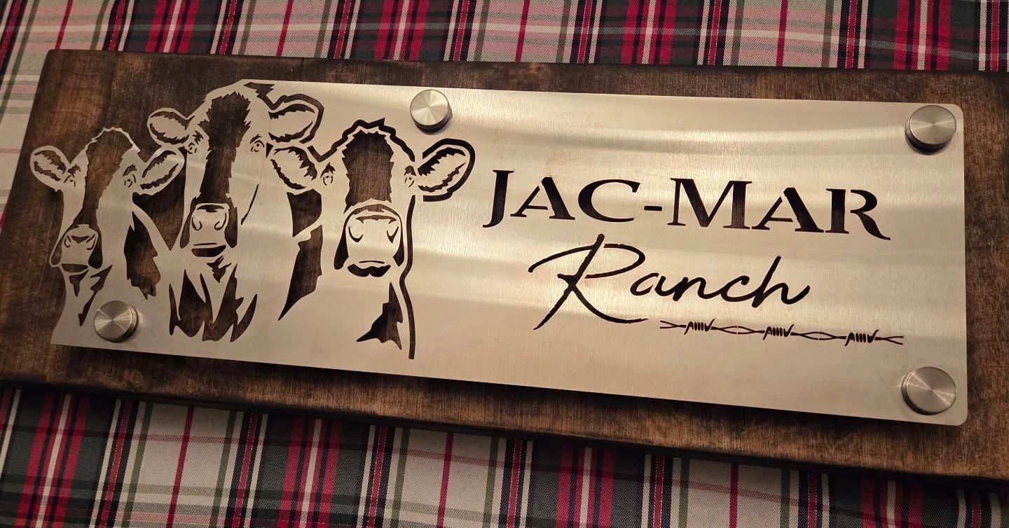 Stainless ranch sign with cattle artwork and lettering