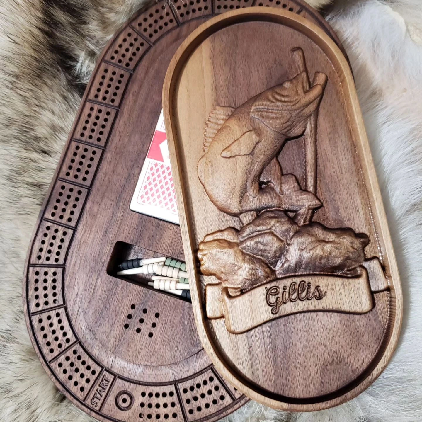 Walnut crib board with detailed fish relief carving