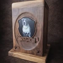 Wood pet memorial urn with a dog portrait