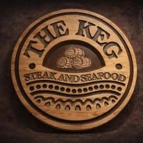 Round carved wood sign reading The Keg Steak and Seafood