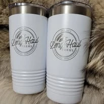 Two white branded travel mugs