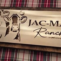 Stainless ranch sign with cattle artwork and lettering