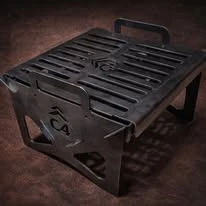 Compact steel fire pit with grill and cutout details