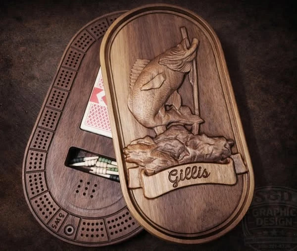 Detailed walnut relief carving featuring a fish and crib board